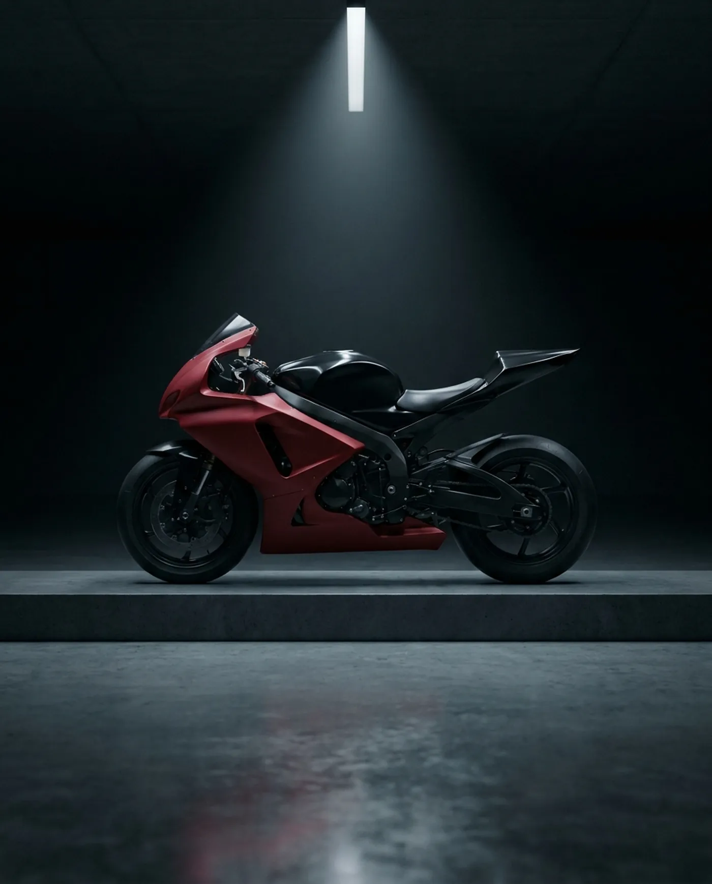 Competition motorcycle replica in a dark showroom